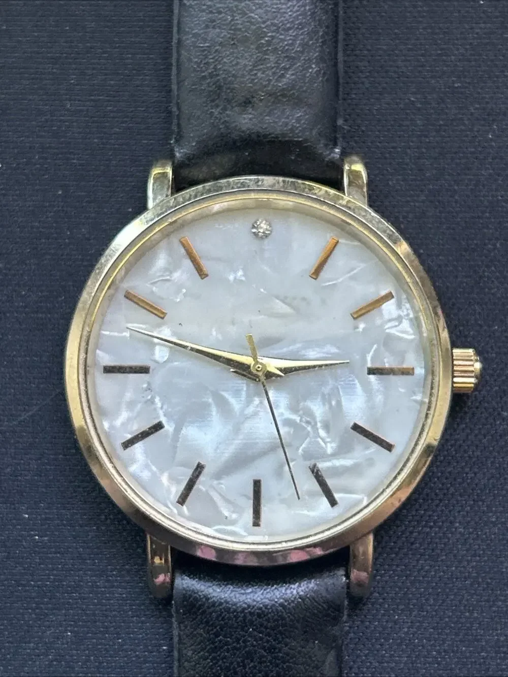 Gold Tone Pearlized Dial Black Band Women’s Quartz Watch